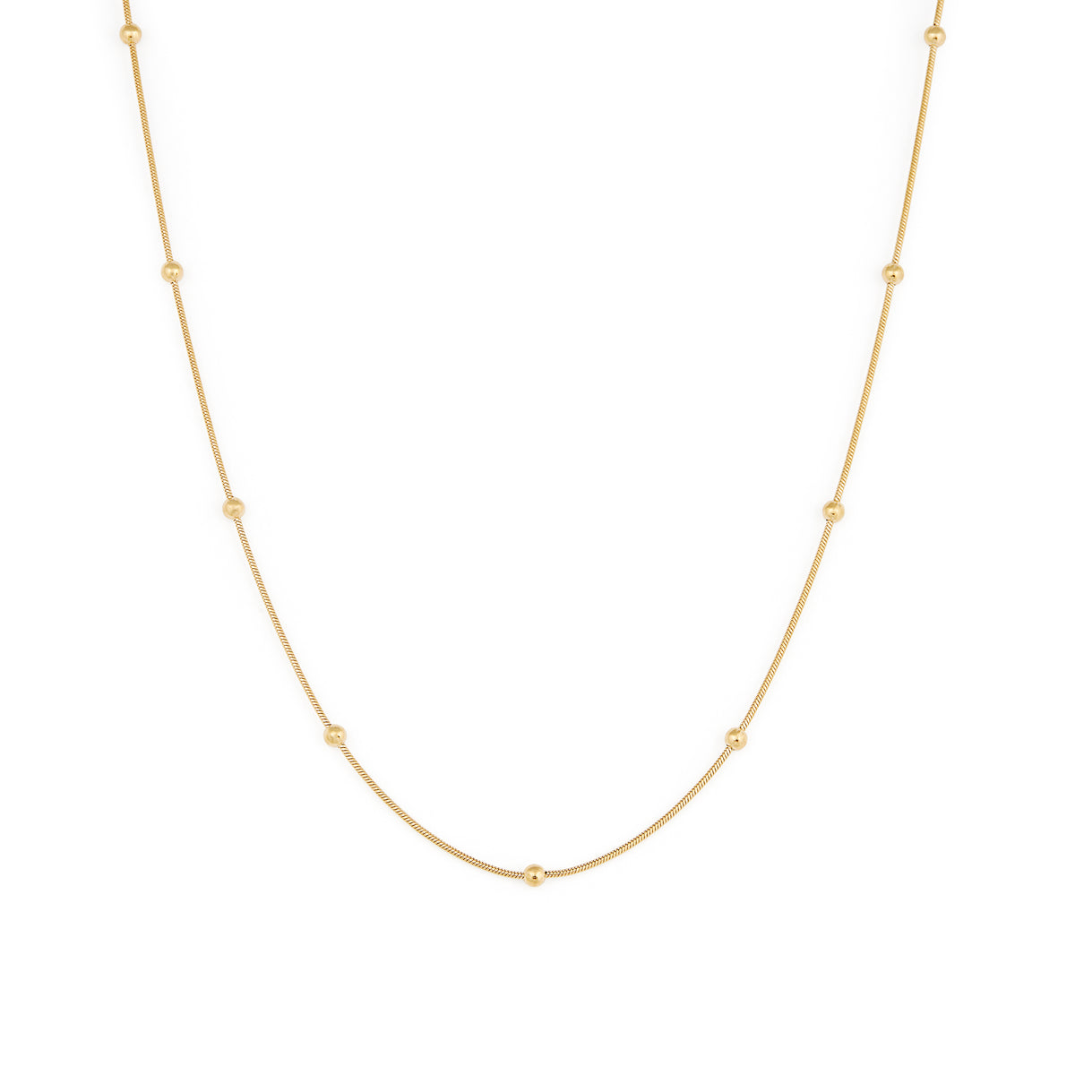A gold-colored necklace with a chain link design and small spherical embellishments evenly spaced along the length. Collier Aura - Or