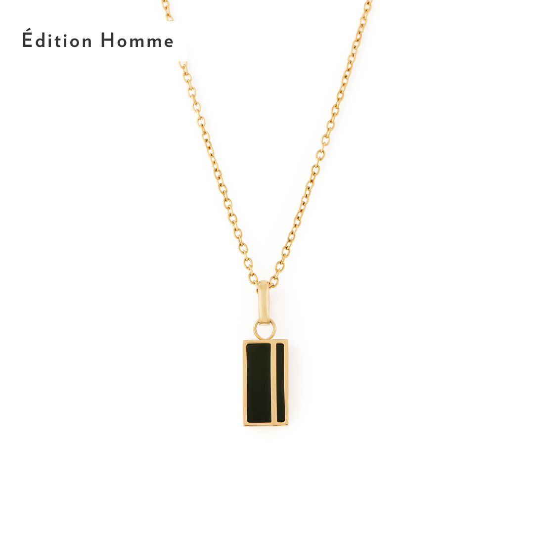 A gold-colored necklace with a black onyx pendant, presented against a white background with the brand name & Jasper Necklace - Gold