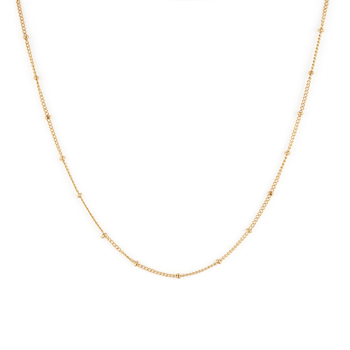 A dainty gold necklace with small spherical embellishments throughout. Sublime Necklace - Gold