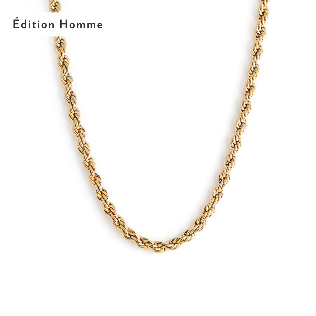 A close-up of the 3mm Rope Necklace - Gold from Twenty Compass showcases its smooth, polished texture against a plain white background. In the upper left corner, stylish black text reads Édition Homme. 3mm Rope Necklace - Gold