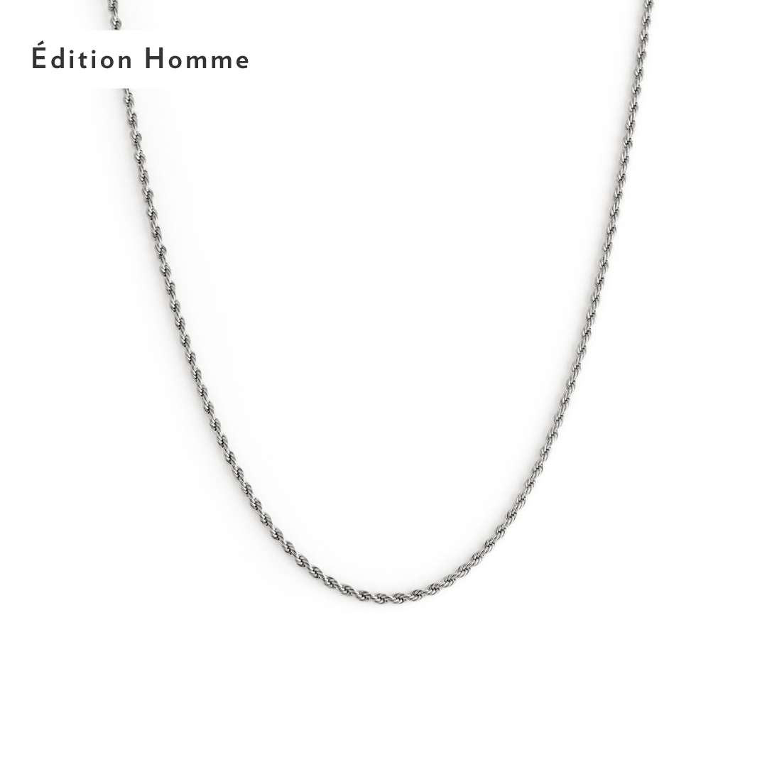 The 2mm Rope Necklace - Silver by Twenty Compass is displayed on a white background, featuring a stylish twisted rope design that adds texture to its elegance. Édition Homme is printed in the top left corner. 2mm Rope Necklace - Silver