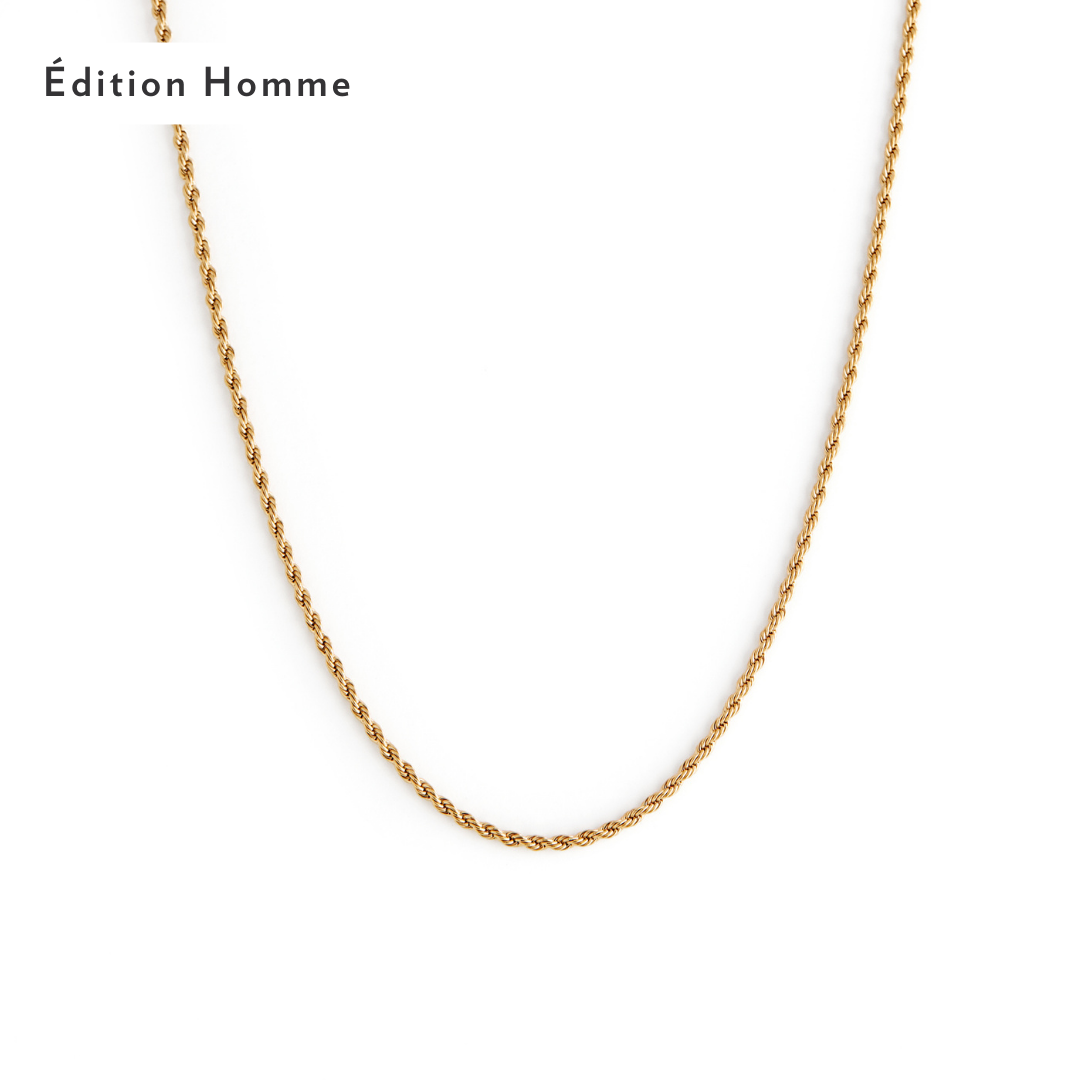 The 2mm Rope Necklace - Gold by Twenty Compass, with exquisite texture and style, is showcased on a plain white background. Édition Homme is elegantly placed in the top left corner. 2mm Rope Necklace - Gold