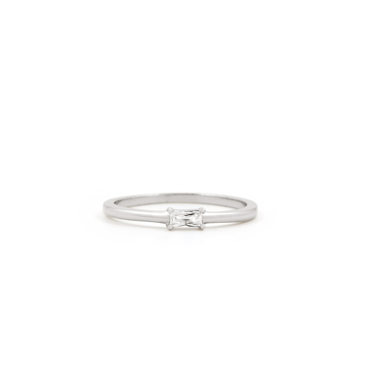 The Twenty Compass Alaska Ring - Silver is a minimalist band with a delicate, sparkly rectangular gemstone at the center, shown on a white background. Alaska Ring - Silver