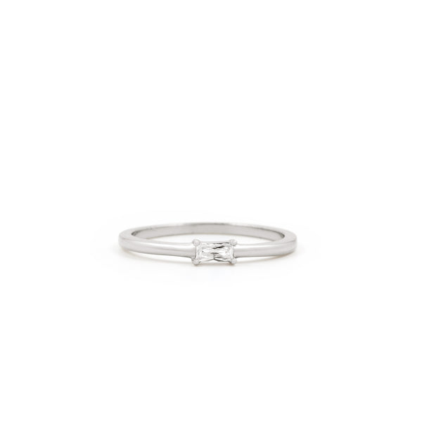 The Twenty Compass Alaska Ring - Silver is a minimalist band with a delicate, sparkly rectangular gemstone at the center, shown on a white background. Alaska Ring - Silver
