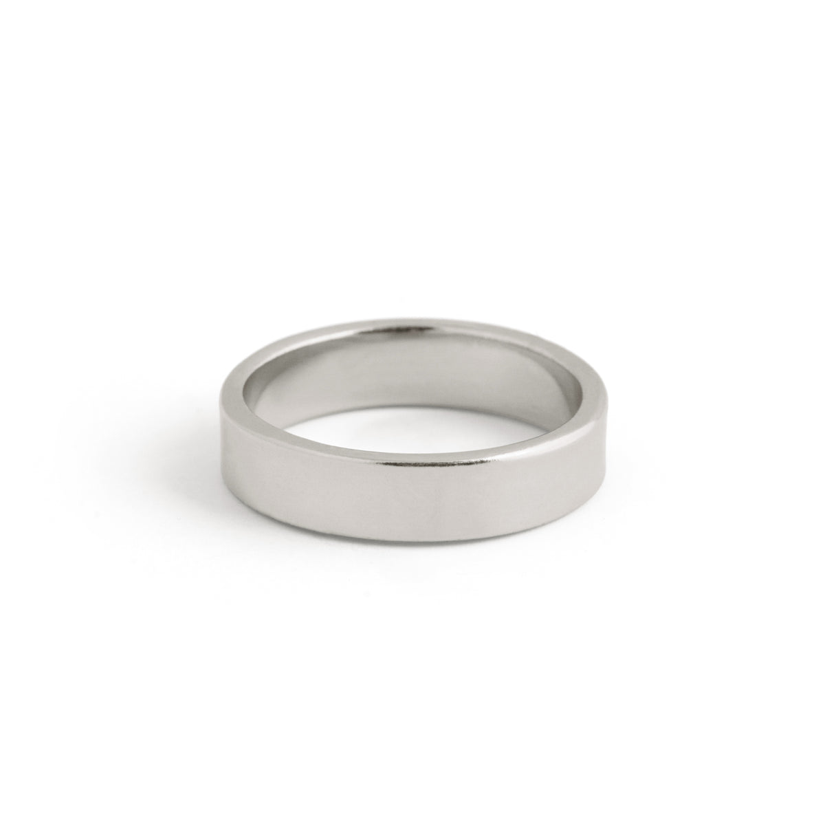 The Twenty Compass 5mm Band Ring - Silver features a minimalist, polished design that gleams on a white background. 5mm Band Ring - Silver