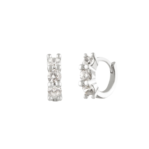 A pair of silver hoop earrings with cubic zirconia embellishments, designed in a minimalist style. Anneaux Éclat - Argent