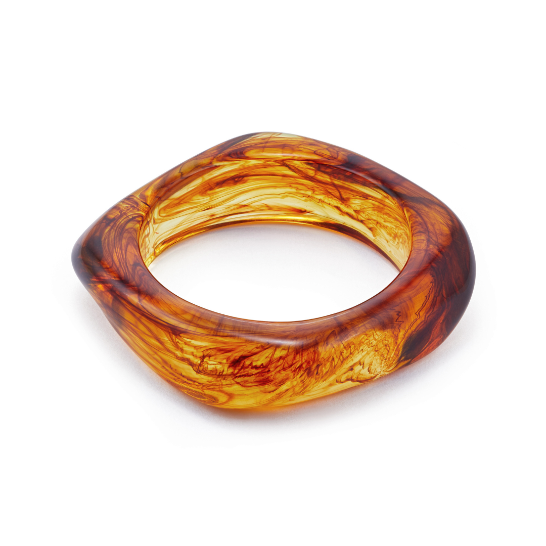 Tortoise bangle on a white background Frame Bangle Cognac