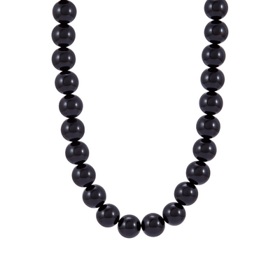 Black beaded necklace on a white background