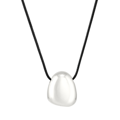 Silver pendant on a black cord against a white background