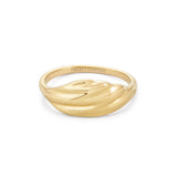 Gold ring with a fluid, wave-like design across the band, on a white background