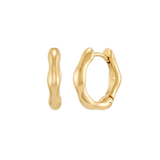 A pair of small, polished gold huggie hoop earrings featuring an irregular, organic wavy silhouette, shown from both front and side profiles, with the letters "TC" subtly engraved on the inner curve, isolated on a white background.