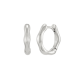 A pair of small, polished silver huggie hoop earrings featuring an irregular, organic wavy silhouette, shown from both front and side profiles, with the letters "TC" subtly engraved on the inner curve, isolated on a white background.