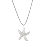A silver starfish pendant on a faux suede cord necklace.