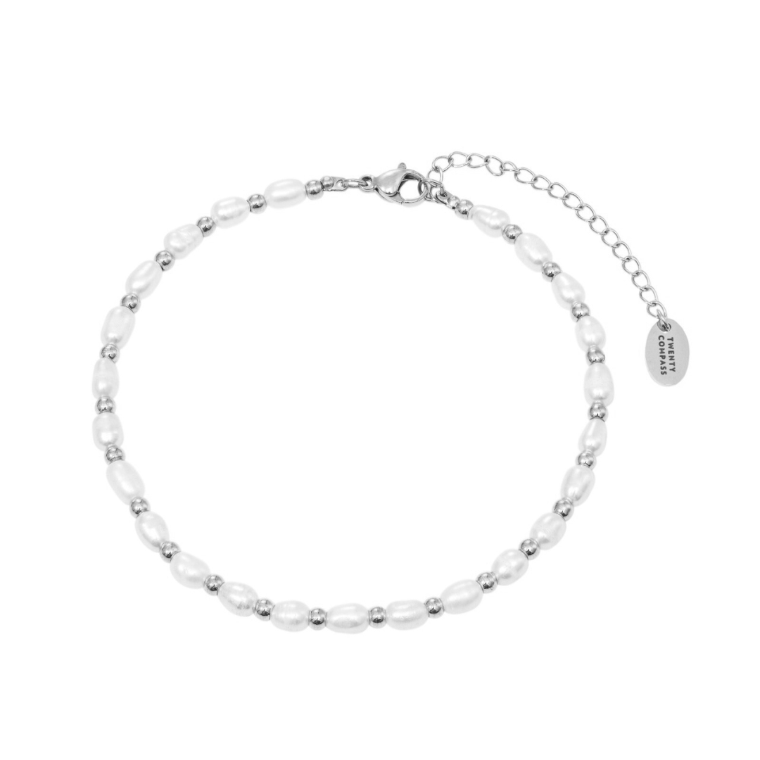 A silver pearl anklet with adjustable chain and freshwater pearls embellished along the length.