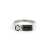Silver ring with Balck and white gemstones on a white background
