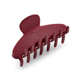 Red hair clip on a white background