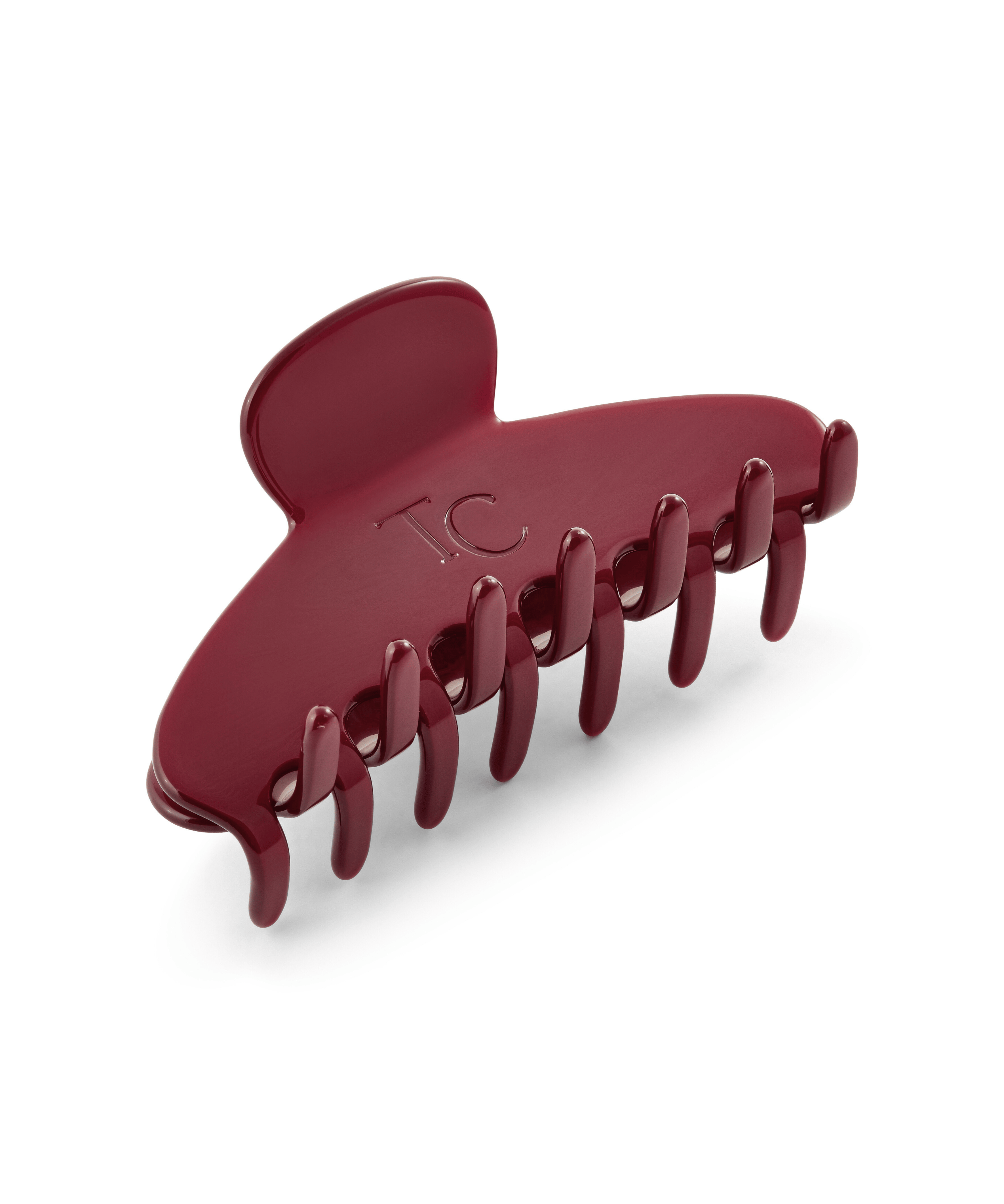 Red hair clip on a white background