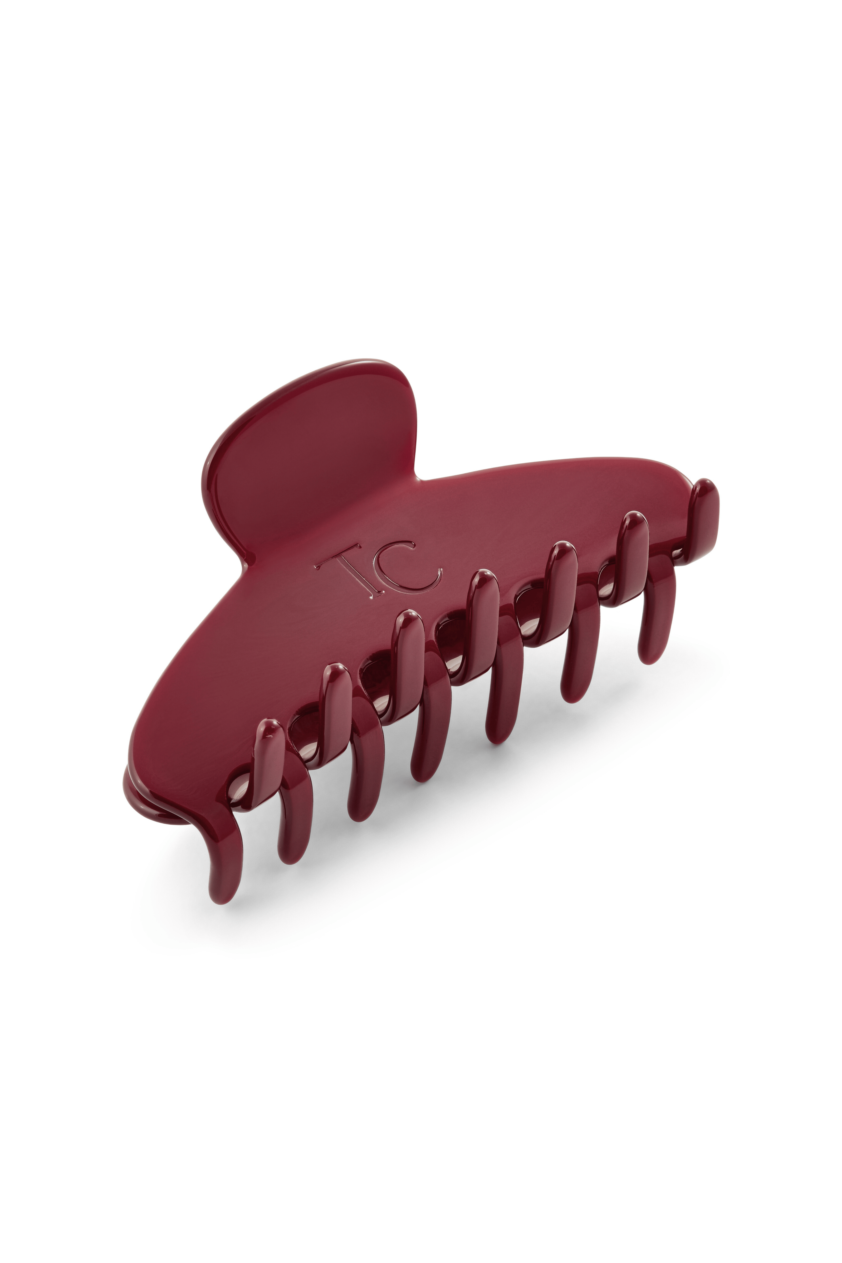 Red hair clip on a white background