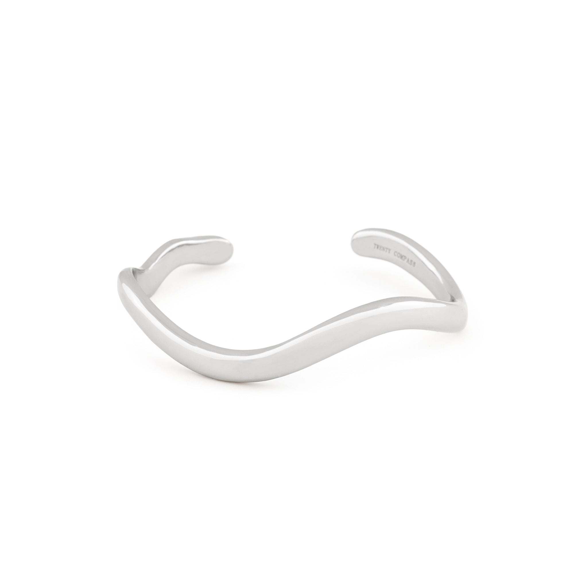  A silver-colored cuff bracelet with an organic shape, displayed against a white background.