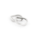 A set of two silver rings with organic shapes, positioned against a white background.