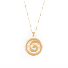 A gold necklace with a spiral-shaped pendant on a chain.