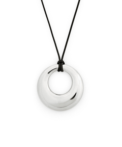 A polished silver-toned circular pendant necklace on a black cord, shown against a plain white background.