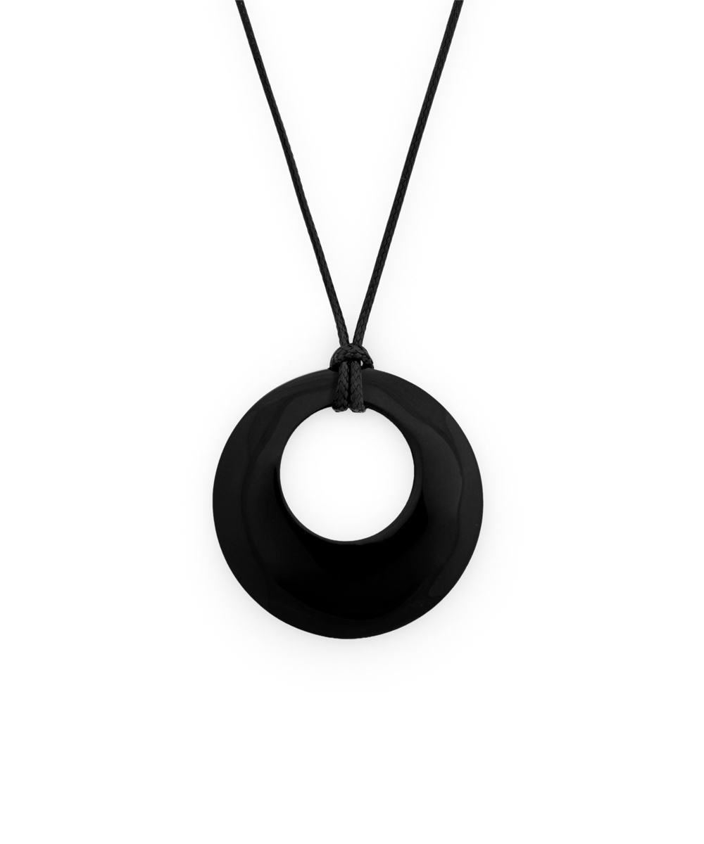 A matte black circular pendant necklace on a black cord, shown against a plain white background.