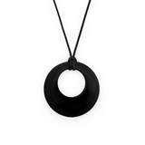A matte black circular pendant necklace on a black cord, shown against a plain white background.