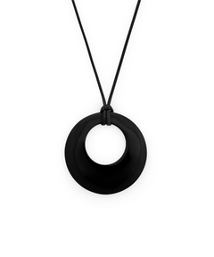 A matte black circular pendant necklace on a black cord, shown against a plain white background.