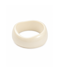 A thick, chunky bangle ring with a smooth, glossy finish in a warm cream or off-white color, photographed on a seamless white background.