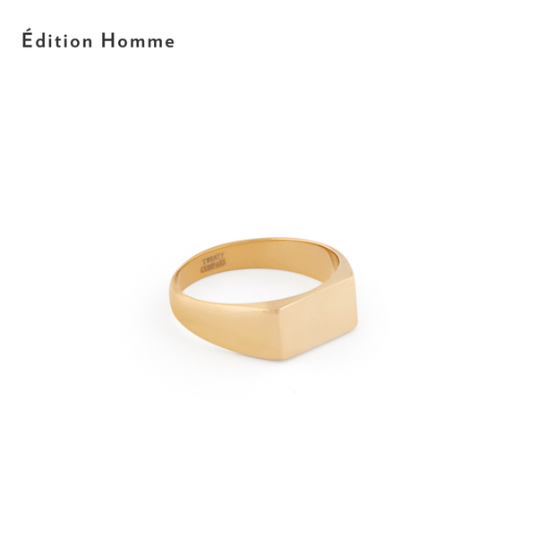 A gold-colored square signet ring against a white background, with the brand name 'Édition Homme' visible. Mayfair Ring - Gold