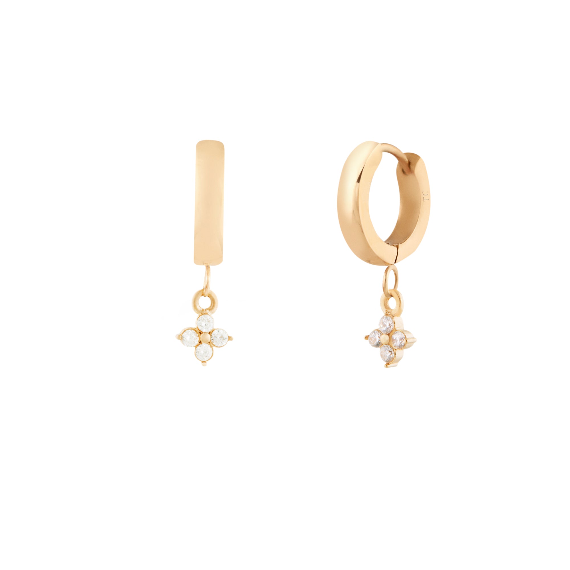 A pair of gold hoop earrings with flower pendant charms, made of cubic zirconias.