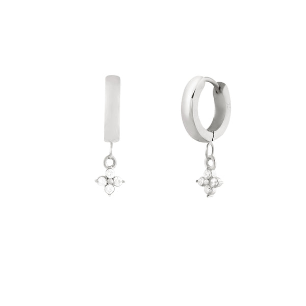 A pair of silver hoop earrings with flower pendant charms, made of cubic zirconias. Anneaux Merveille- Acier Inoxydable
