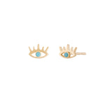 A pair of 10 karat gold stud earrings in the shape of eyes, adorned with a turquoise stone.
