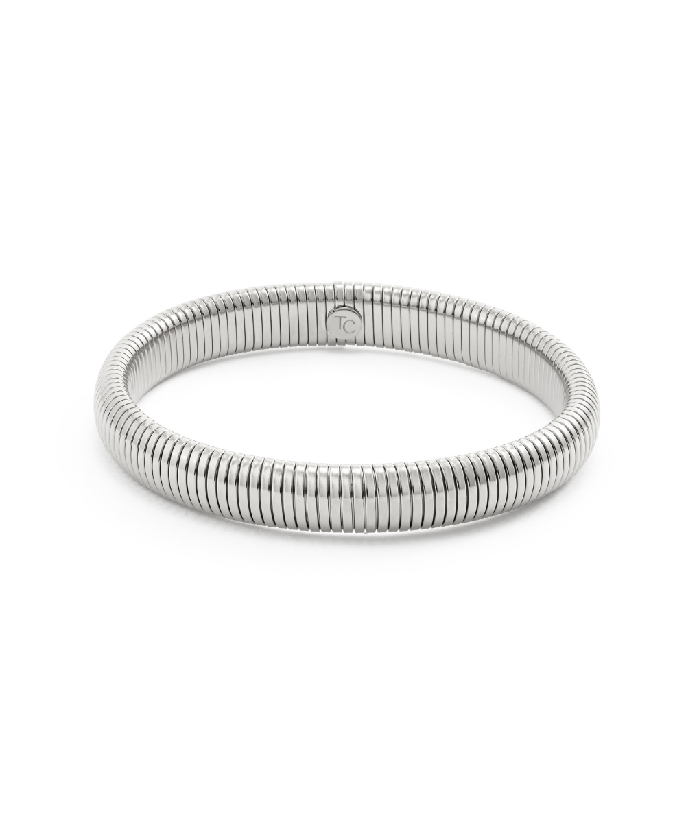 Chunky silver gaspipe bangle bracelet with a ribbed tubogas texture, isolated on a white background.