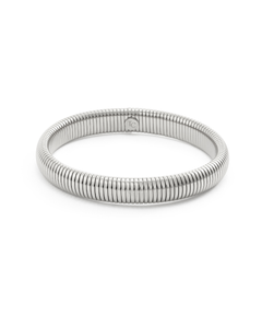 Chunky silver gaspipe bangle bracelet with a ribbed tubogas texture, isolated on a white background.