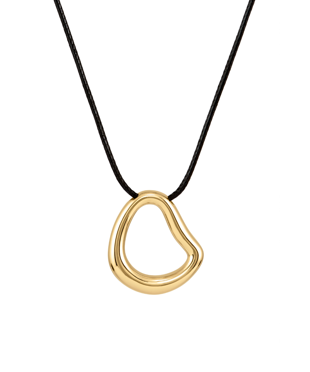 A modern necklace with an irregular, organic-shaped polished gold open-loop pendant suspended from a simple black cord, isolated on a white background.