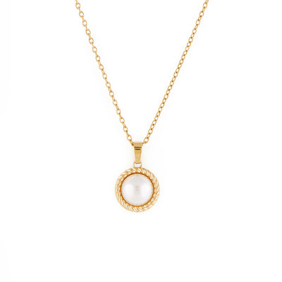A vintage inspired freshwater pearl pendant necklace on a gold minimalist chain.