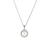 A silver necklace with a vintage inspired freshwater pearl pendant on a minimalist chain.
