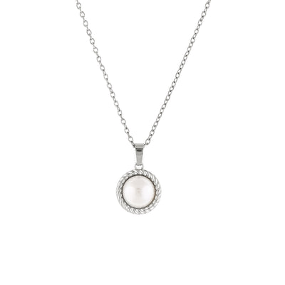 A silver necklace with a vintage inspired freshwater pearl pendant on a minimalist chain.