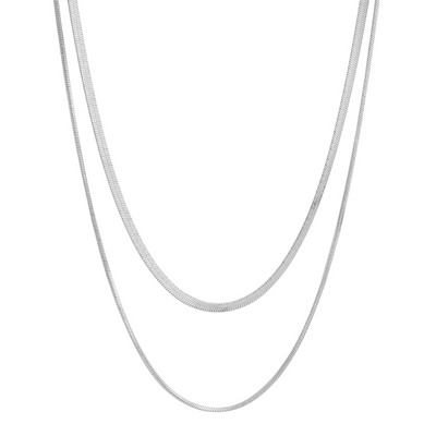 Two silver herringbone chain necklaces, one slightly longer than the other, laid vertically against a white background