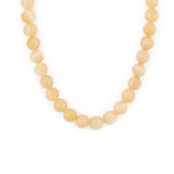 A necklace with round yellow beads, likely representing the sun, against a white background.