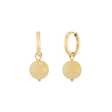 Pair of gold huggie hoop earrings featuring dangling round yellow gemstone beads, isolated on a white background.