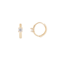 A pair of 14 karat gold hoop earrings with a small cubic zirconia centerpiece, displayed against a white background.