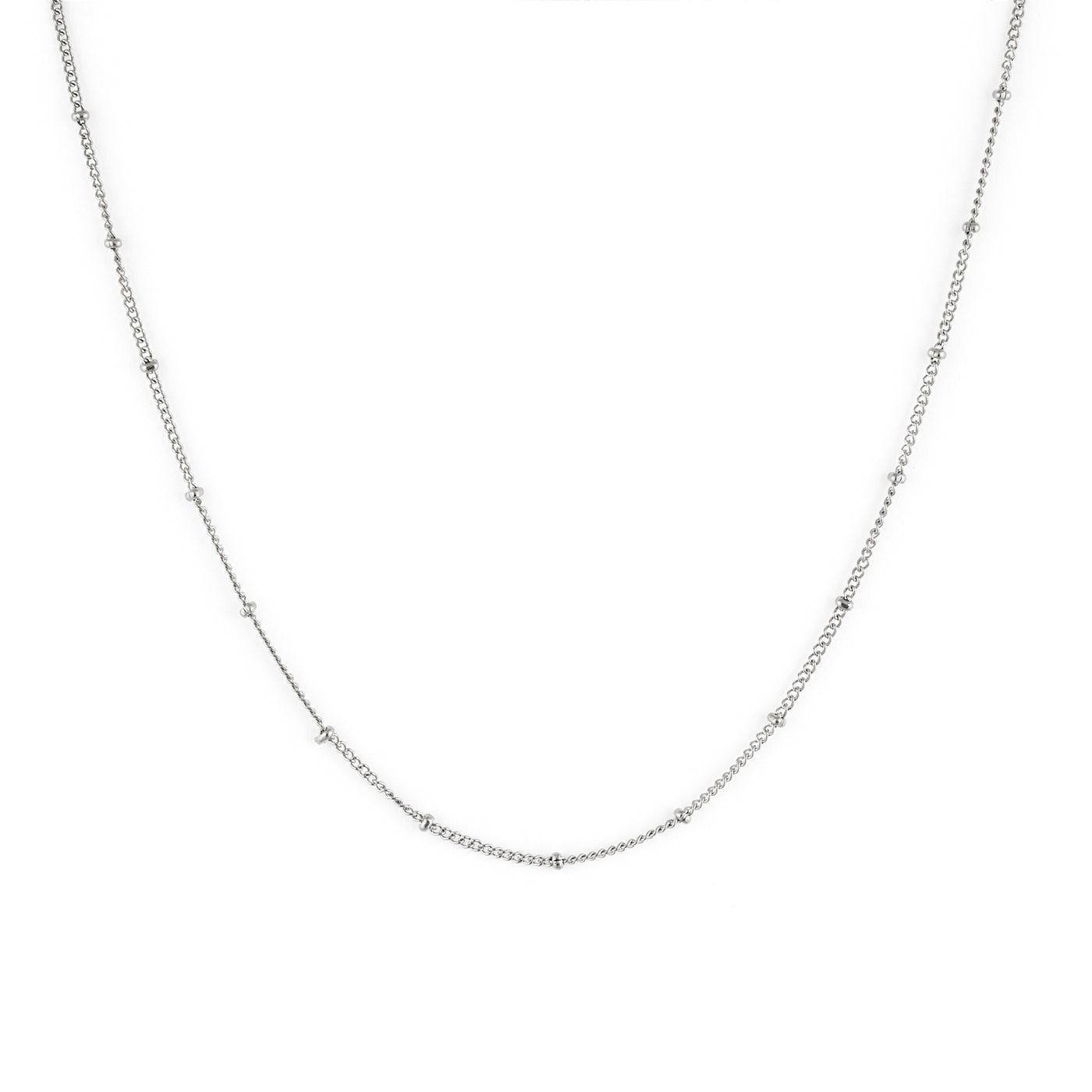 A silver necklace with a dainty chain and small spherical embellishments, displayed on a plain background. Sublime Necklace - Silver