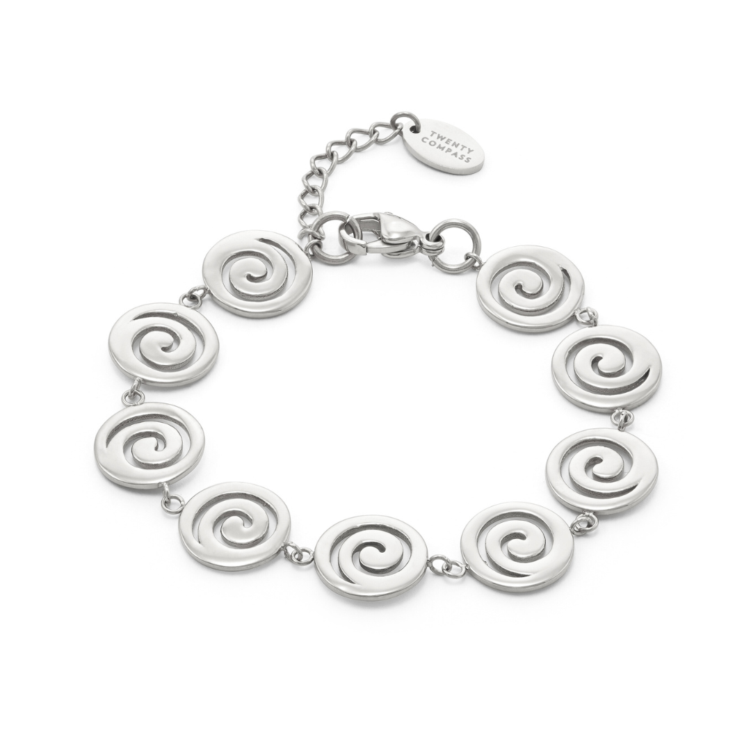 Silver bracelet with spiral designs on a white background