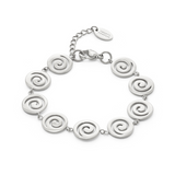 Silver bracelet with spiral designs on a white background