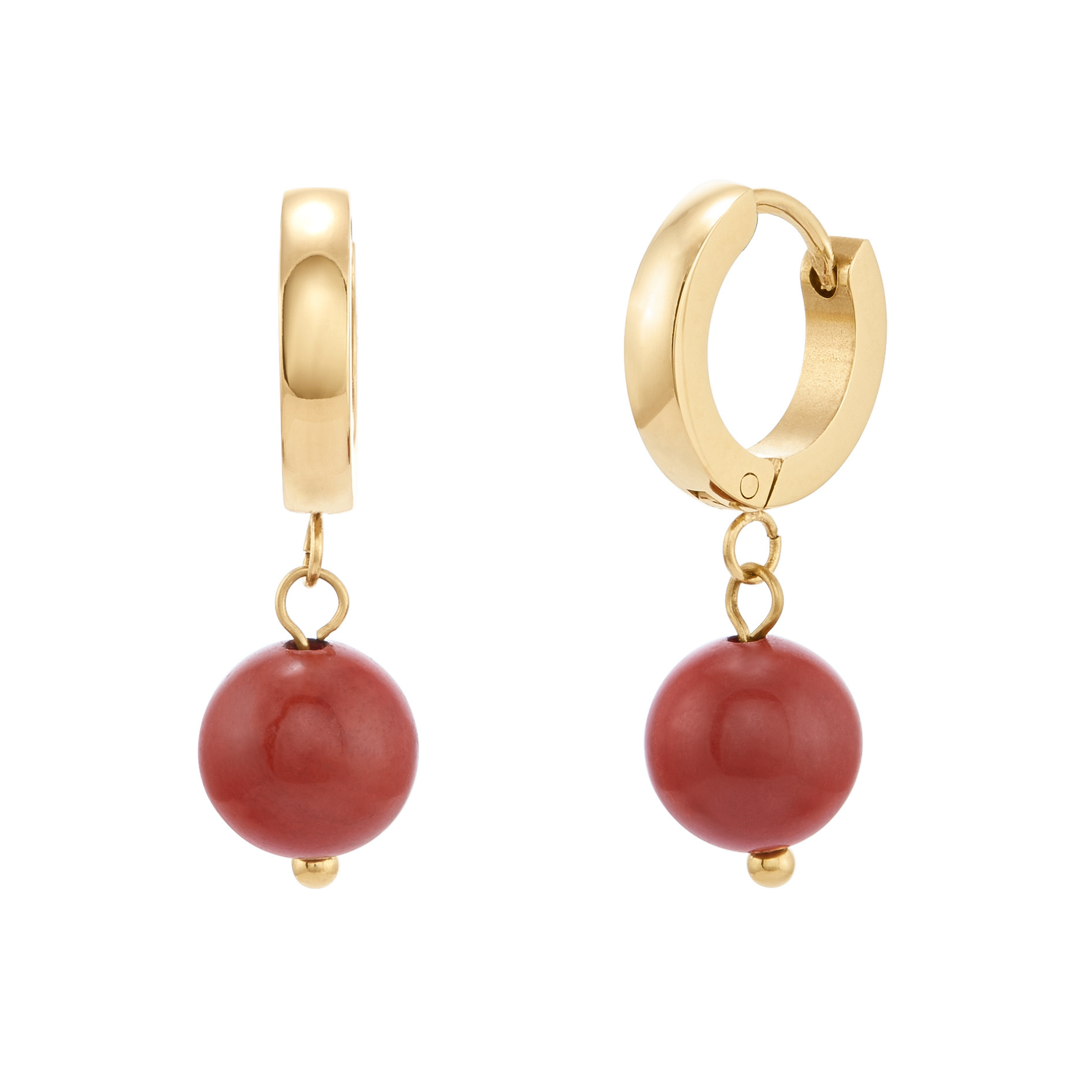 Gold hoop earrings with red spherical charms on a white background