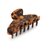 Tortoiseshell patterned hair clip on a white background