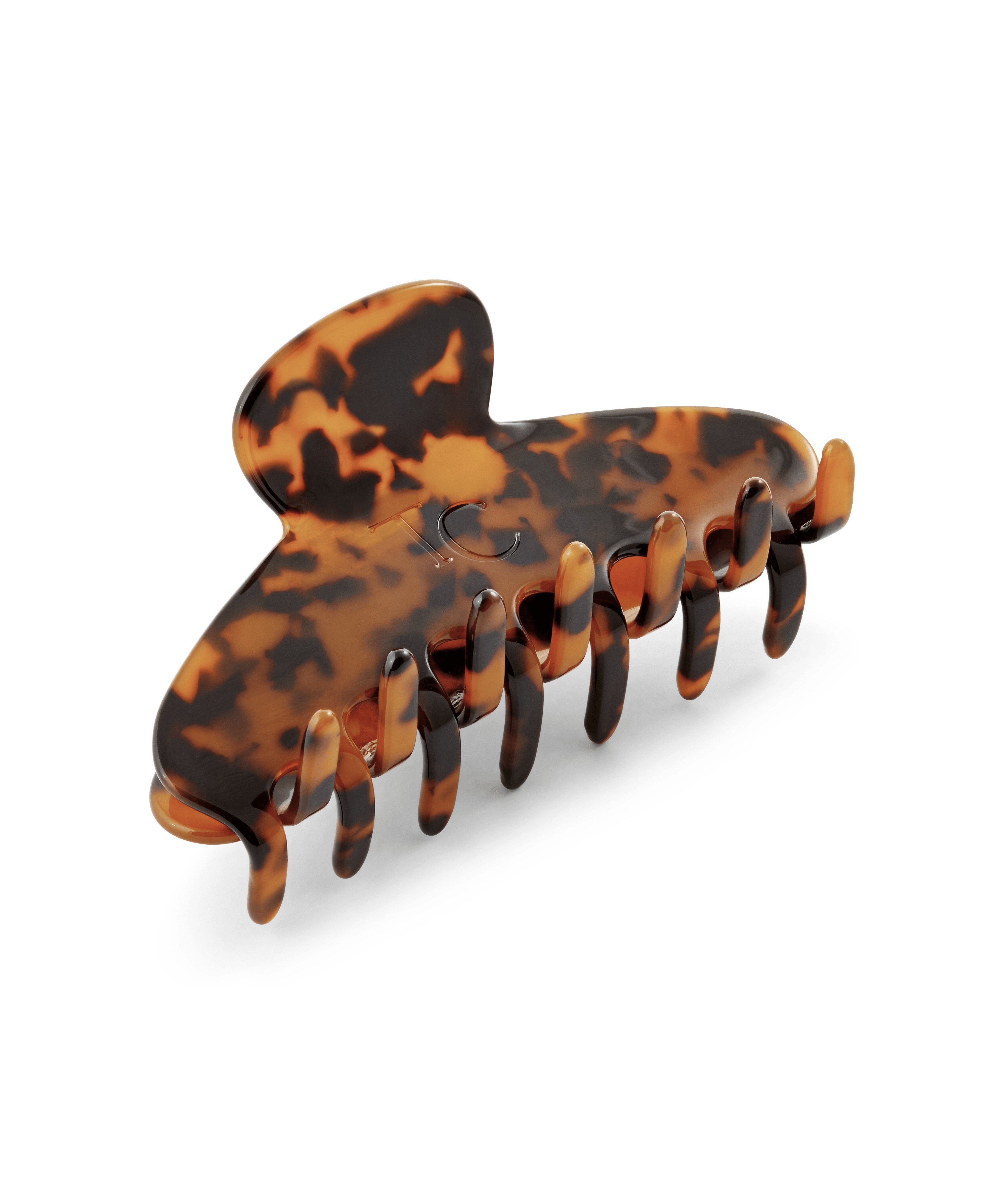 Tortoiseshell patterned hair clip on a white background